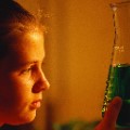 photo of girl with glass beaker