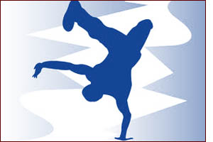 Silhouette of a man doing a flip with one hand on the ground.