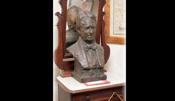 Bust of a man wearing a bow tie.