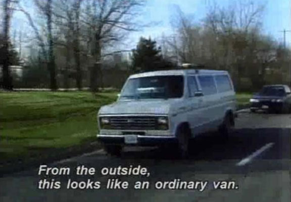 white letters, upper and lower case captions with a slight shadow: From the outside, this looks like an ordinary van.