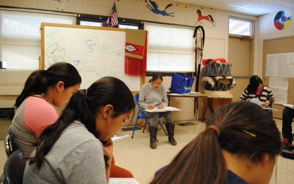 Native American classroom with students and teacher.