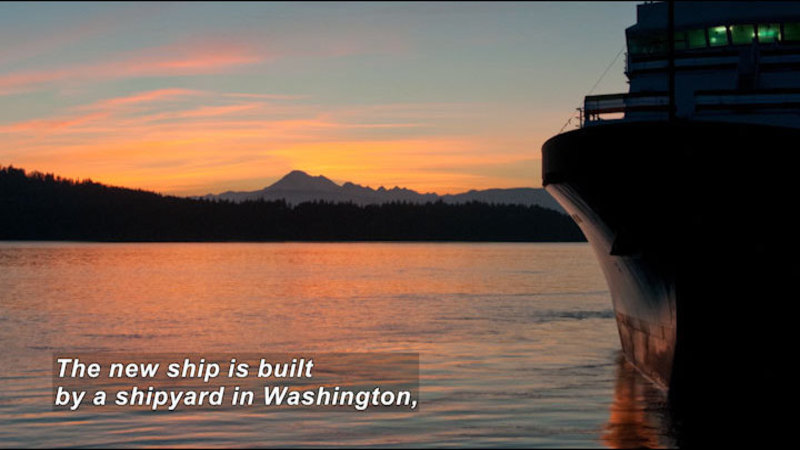 A large ship floating in the water. Caption: The new ship is built by a shipyard in Washington,