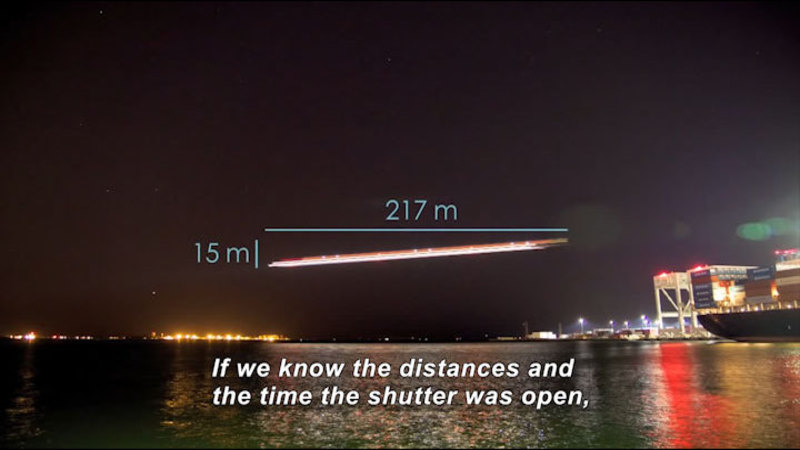 Streak of light across a night sky with a change in height of 15m and a length of 217m. Caption: If we know the distances and the time the shutter was open,