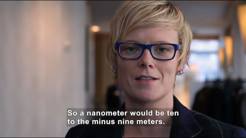 Person speaking. Caption: So a nanometer would be ten to the minus nine meters.