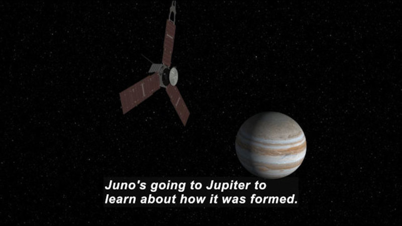 A hexagonal space craft with three much larger wings equally spaced around the hexagonal base flying in space with the planet Jupiter in the distant background. Caption: Juno's going to Jupiter to learn about how it was formed.