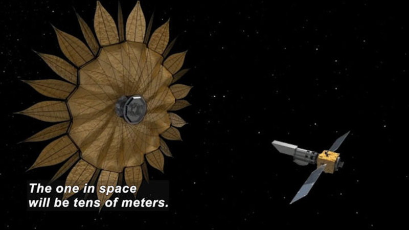 A roughly rectangular space craft with two solar wings approaches a much larger round spacecraft surrounded in petal-like protrusions. Caption: The one in space will be tens of meters.