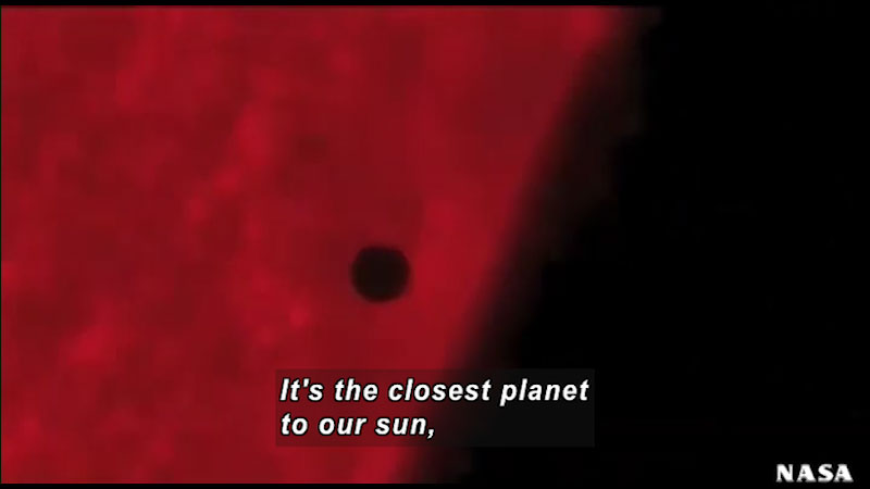 Small spherical object in relief against a red glowing background. Caption: It's the closest planet to our sun,