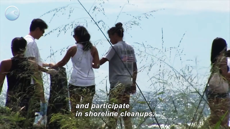 Five people picking up trash. Caption: and participate in shoreline cleanups. 