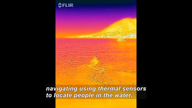 Body of water in shades of red, yellow, range, and pink showing heat gradients. Caption: navigating using thermal sensors to locate people in the water,