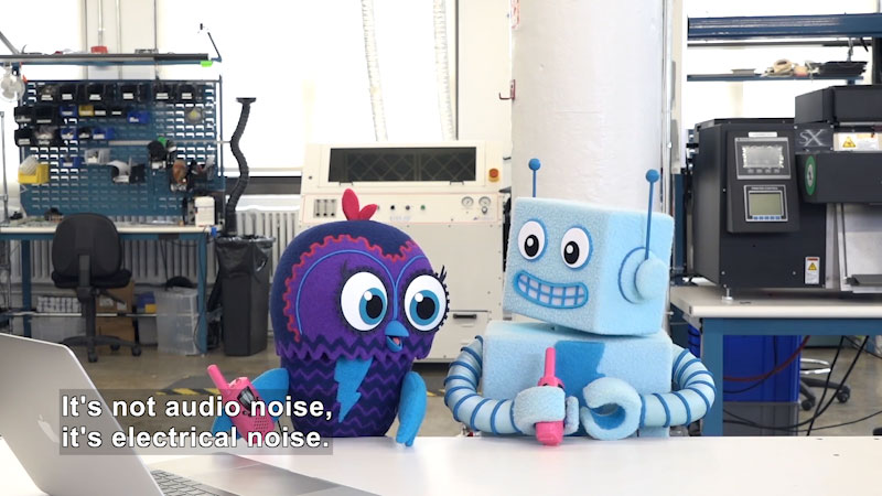 Robot and bird with walkie-talkies in a workshop. Caption: It's not audio noise, it's electrical noise.