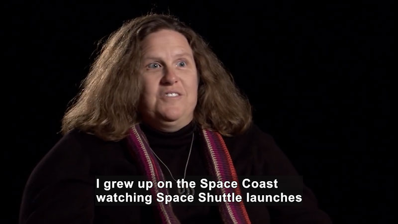 Woman speaking. Caption: I grew up on the Space Coast watching Space Shuttle launches