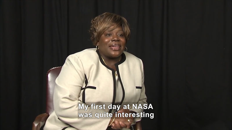 Woman speaking. Caption: My first day at NASA was quite interesting