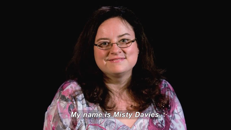 Woman speaking. Caption: My name is Misty Davies,