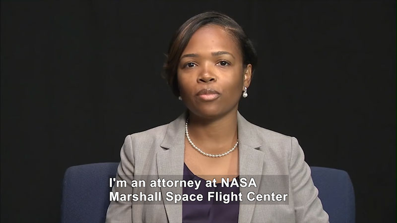 Woman speaking. Caption: I'm an attorney at NASA Marshall Space Flight Center