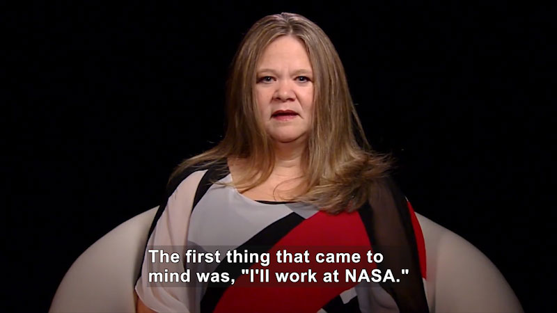 Woman speaking. Caption: The first thing that came to mind was, "I'll work at NASA."