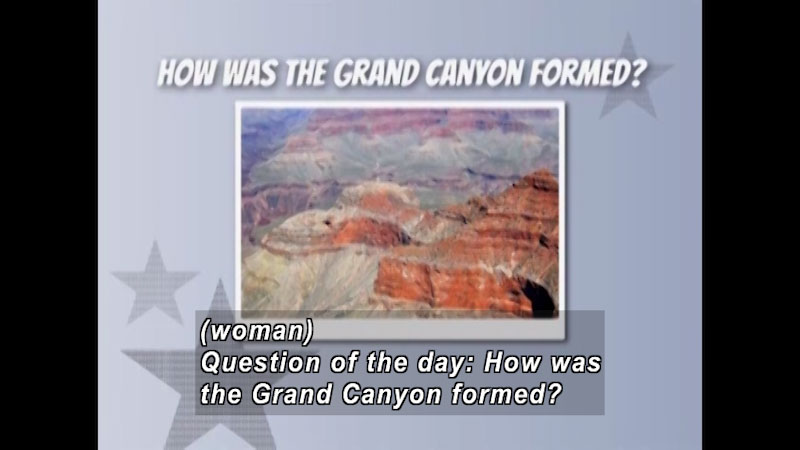 Layers of red sedimentary rock forming the cliffs to the Grand Canyon. Caption: (woman) Question of the day: How was the Grand Canyon formed?