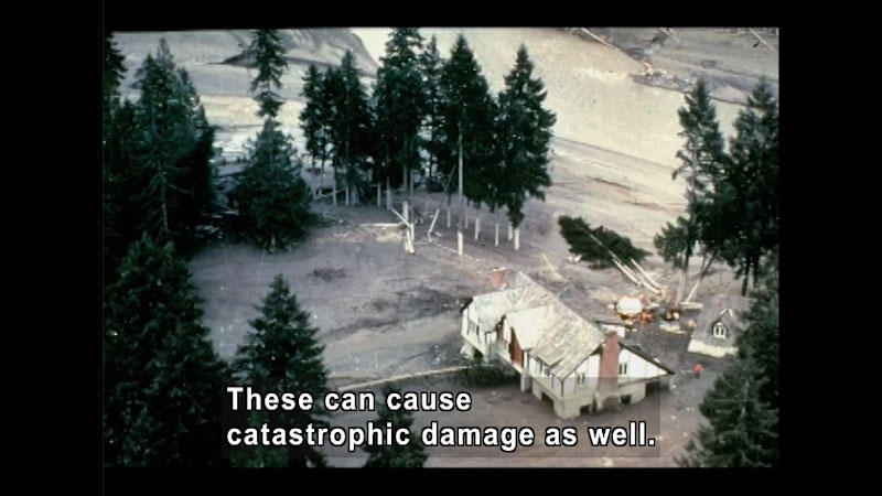 Aerial view of destroyed house and fallen trees. Caption: These can cause catastrophic damage as well.