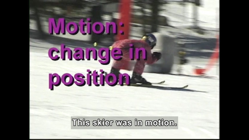 Person on skis in a crouched position. Motion: change in position. Caption: This skier was in motion.