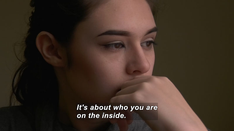Closeup of a young woman's face. Caption: It's about who you are on the inside.