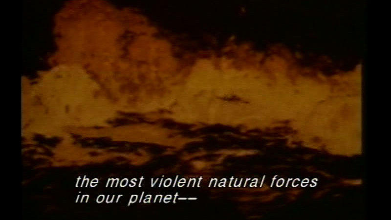 Boiling orange-red magma. Caption: the most violent natural forces in our planet--