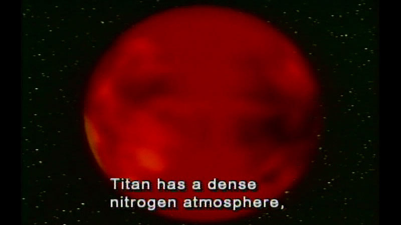 Bright red planet with a mottled surface. Caption: Titan has a dense nitrogen atmosphere,
