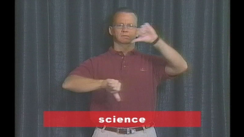 Person doing sign language. Hands are closed with thumbs out. Thumbs are pointing downwards, one arm at about chest height and the other about shoulder height. Caption: science