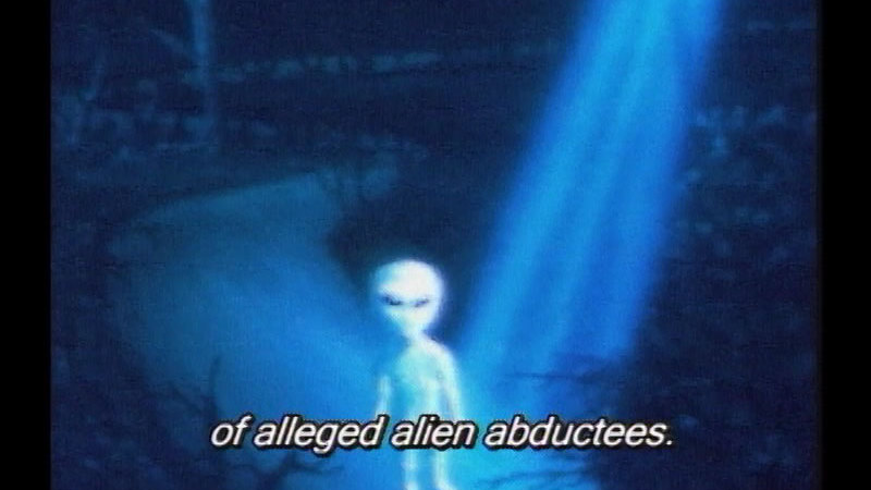 Illustration of an alien standing in a beam of light. Caption: of alleged alien abductees.