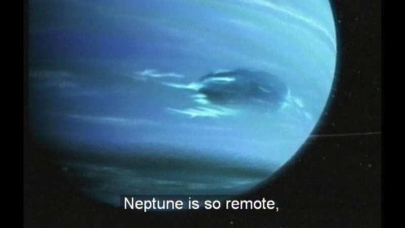 Large blue planet with a darker blue spot. Caption: Neptune is so remote,