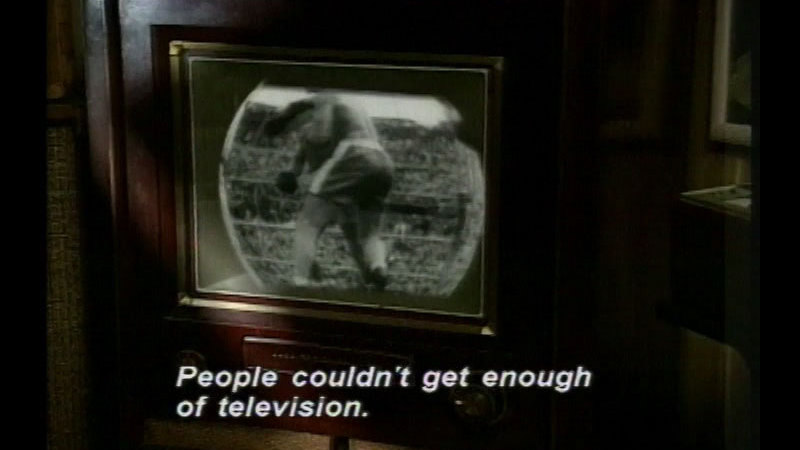 Black and white television set. Caption: People couldn't get enough of television.
