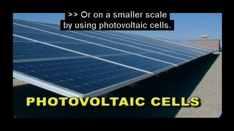 A large bank of solar panels. Photovoltaic cells. Caption: Or on a smaller scale by using photovoltaic cells.