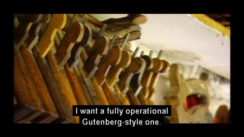Carved wooden levers. Caption: I want a fully operational Gutenberg-style one.