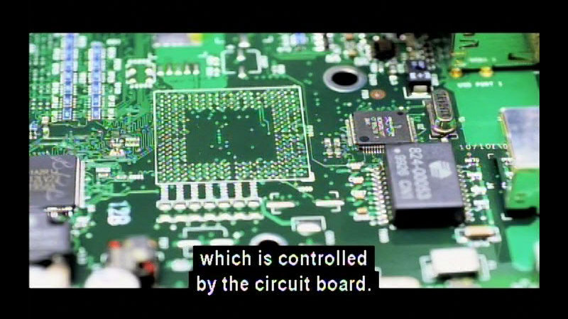 Closeup of a circuit board. Caption: which is controlled by the circuit board.