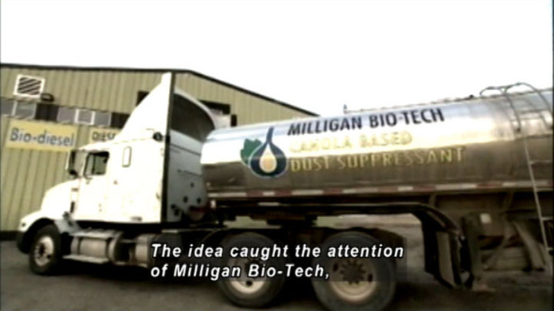  Semi-truck with a tank labeled "Milligan Bio-Tech Canola based dust suppressant." Caption: The idea caught the attention of Milligan Bio-Tech.