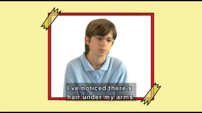 A boy who looks sad and confused. Caption: I've noticed there's hair under my arms.