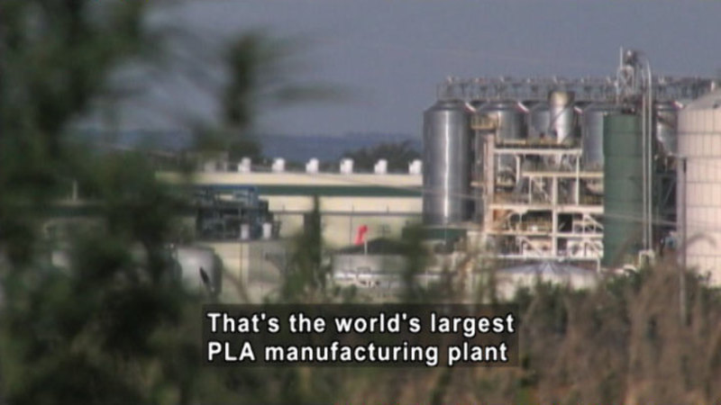 Industrial plant from a distance. Caption: That's the world's largest PLA manufacturing plant.