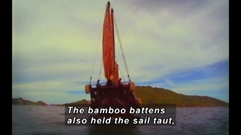 Boat on the water. Caption: The bamboo battens also held the sail taut,