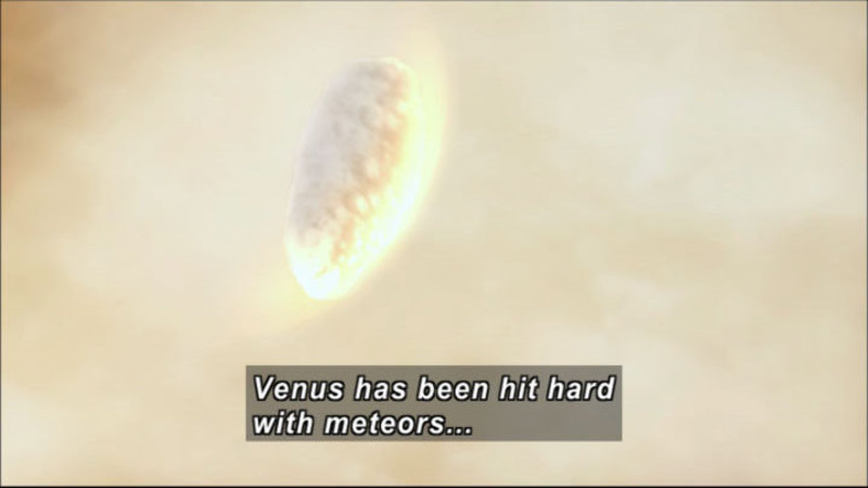 Meteor on fire traveling downwards. Caption: Venus has been hit hard with meteors…