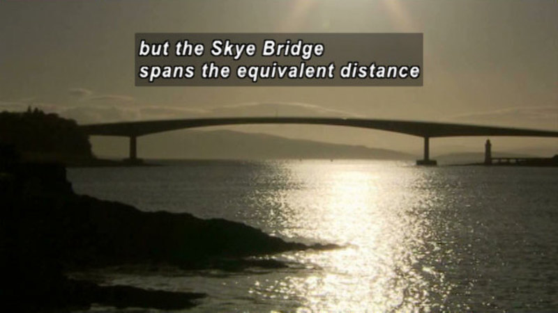 Gently arching bridge over a large body of water. Caption: but the Skye Bridge spans the equivalent distance