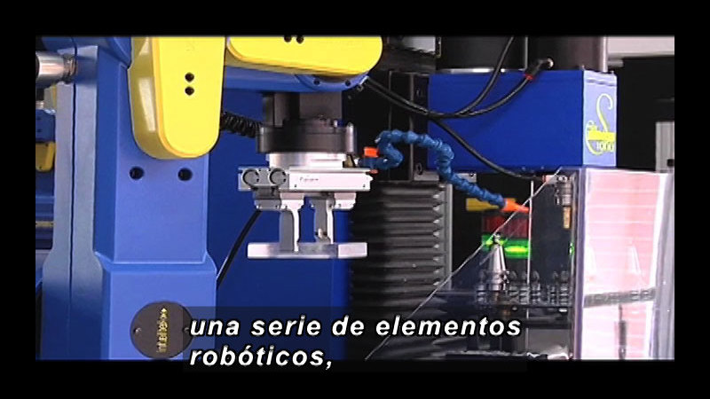 Complex robotic machinery. Spanish captions.