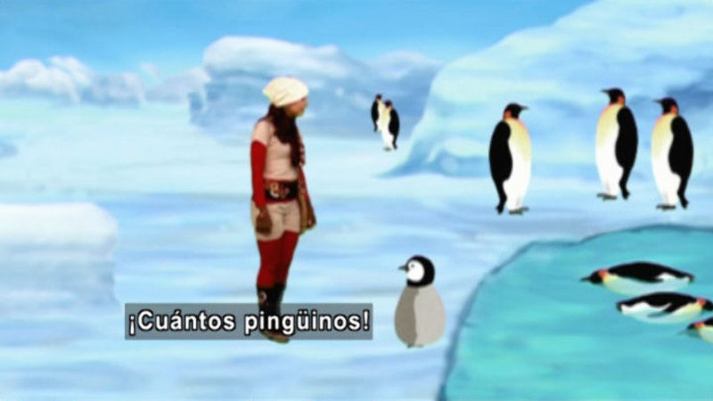 A woman against an illustrated background with penguins. Spanish captions.