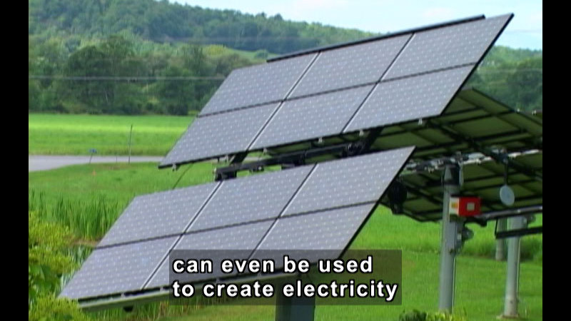 Solar panels tilted toward the sky. Caption: can be used to create electricity