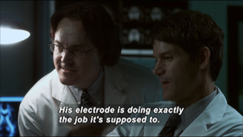 Two people in lab coats. Caption: His electrode is doing exactly the job it's supposed to.