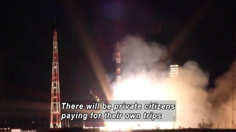 Rocket launching. Caption: There will be private citizens paying for their own trips