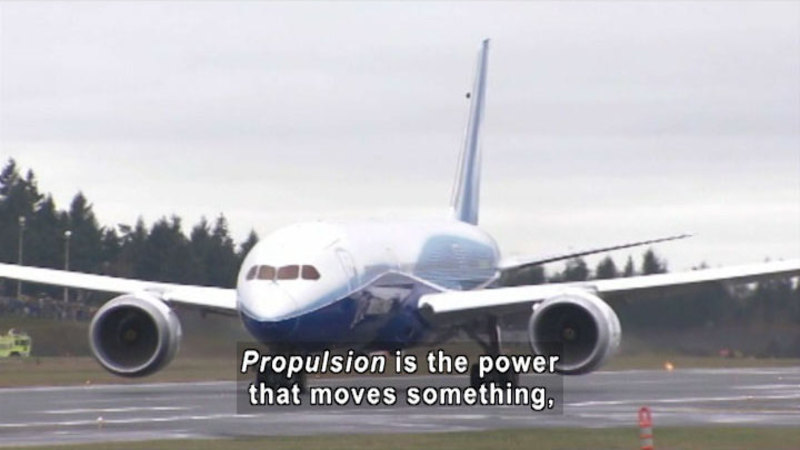 Large plane taxiing on a runway. Caption: Propulsion is the power that moves something,
