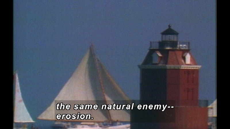 A lighthouse with the sails of ships in the background. Caption: the same natural enemy-- erosion.