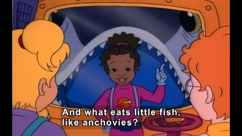 People inside the magic school bus with a giant fish opening its mouth to swallow them visible through the window outside. Caption: And what eats little fish, like anchovies?