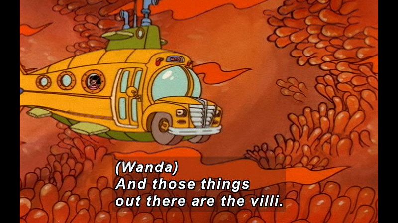 Magic school bus floating in a cavern lined with red, finger-like structures. Caption: (Wanda) And those things out there are the villi.