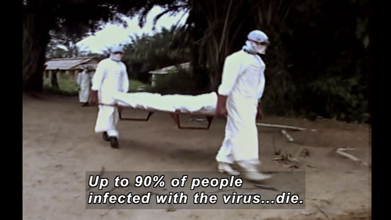 Two people in white protective suits with goggles and gloves carrying a stretcher with a body wrapped in a white sheet. Caption: Up to 90% of people infected with the virus … die.