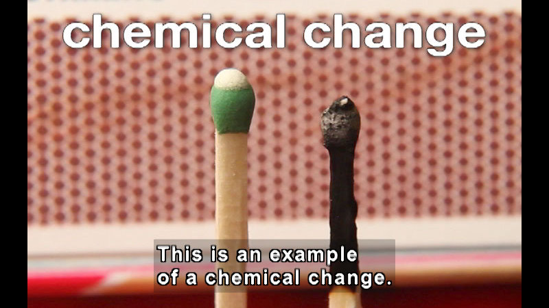 Two matches, one unlit, the other with the tip burned and extinguished. Chemical change. Caption: This is an example of a chemical change.