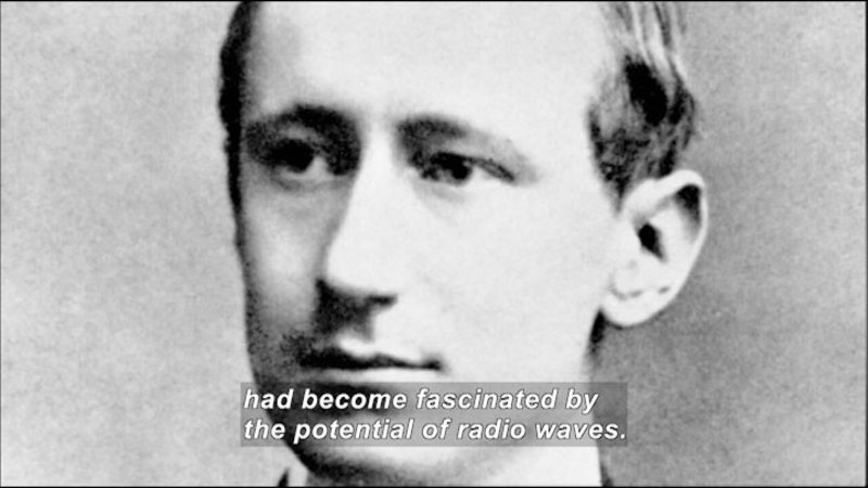 Black and white close up photo of a man's face. Caption: had become fascinated by the potential of radio waves.